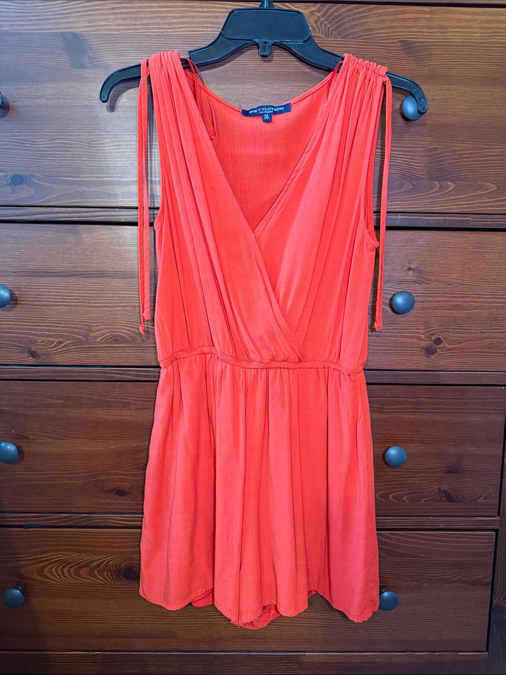 One Clothing NWOT Soft Coral Romper with Button Closure Wrap Front & Pockets
